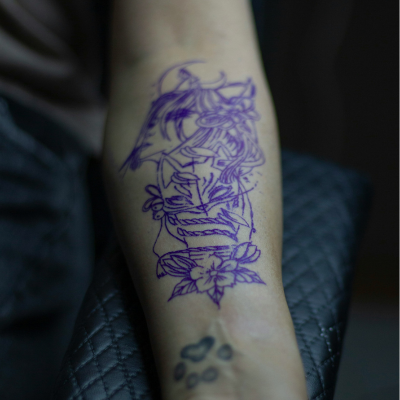 The stencil, the first step before using needles Illustration of a stencil on the arm